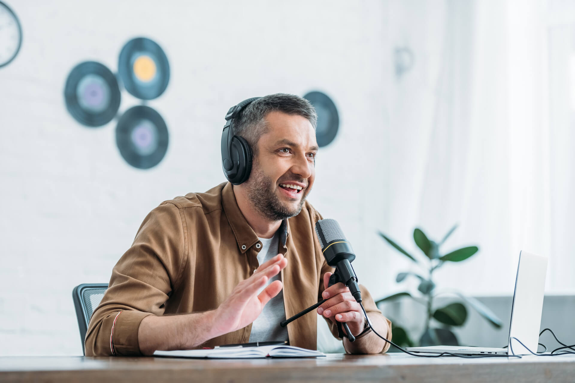 cheerful-radio-host-gesturing-while-recording-podc-2021-09-03-07-42-01-utc.jpg