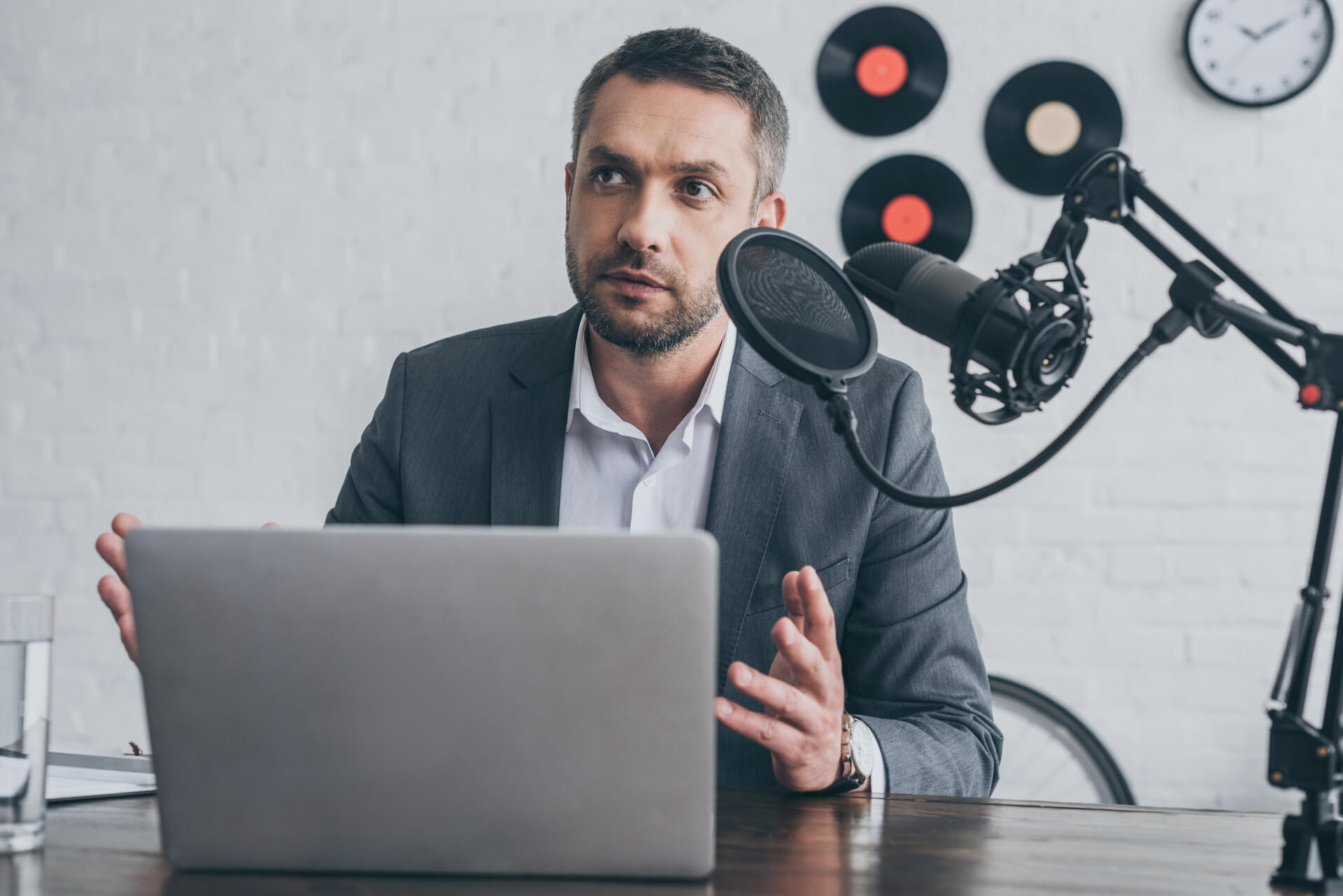 handsome-radio-host-gesturing-while-speaking-in-mi-2021-09-15-00-45-32-utc.jpg