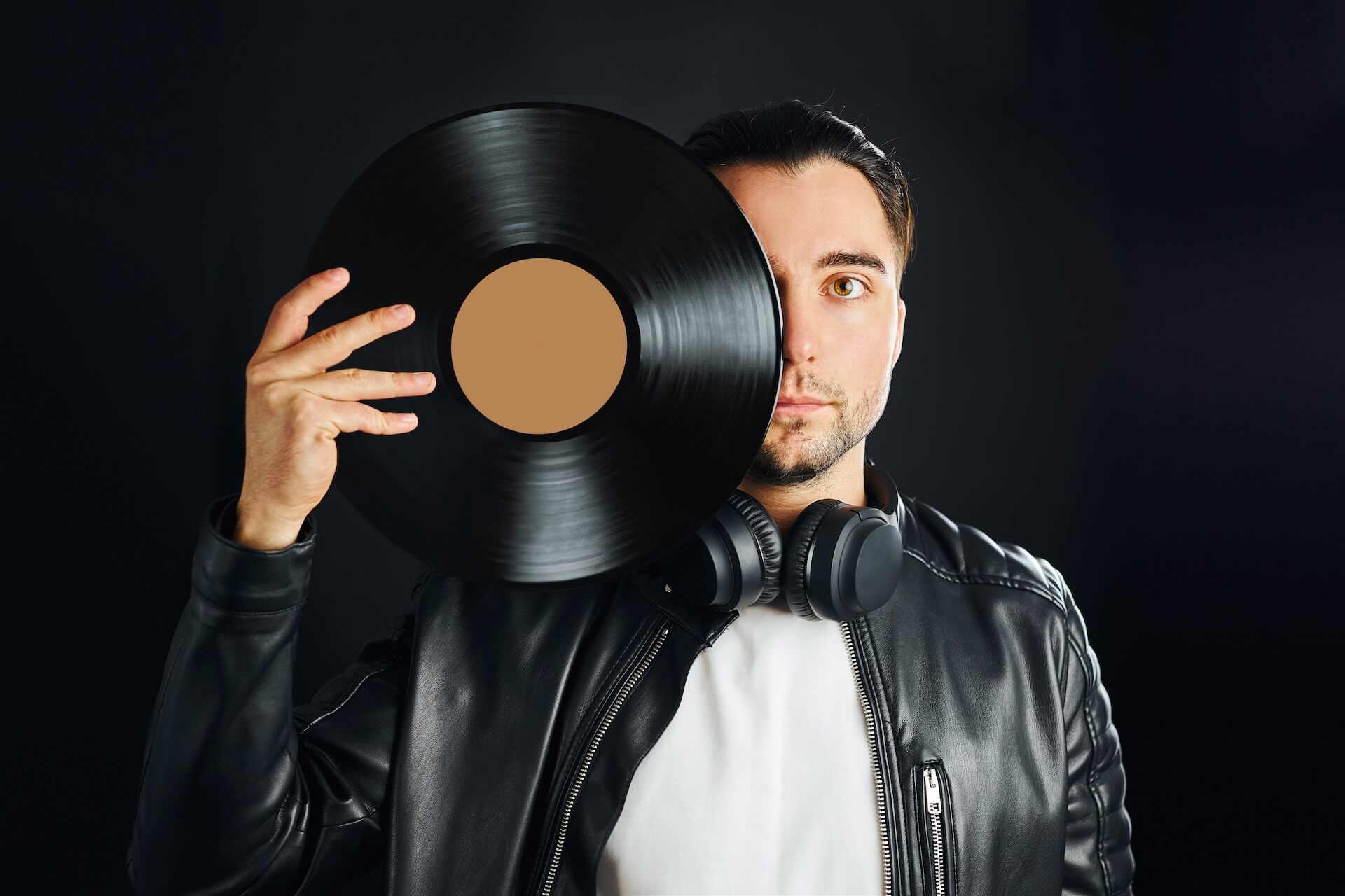 music-vinyl-record-man-holding-black-vinyl-record-2022-08-01-04-33-21-utc.jpg